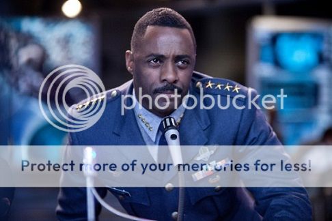 Stacker Pentecost in his military uniform with four stars on his shoulder, standing at a microphone and making me swoon