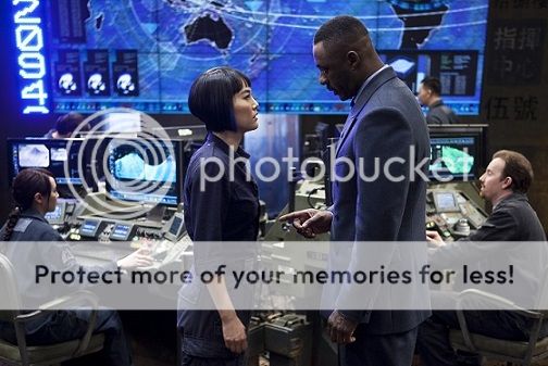 Stacker and Mako standing face to face in mission control